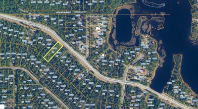 Nearly 3/4 Acre Lot on Caswell Lakes Road - Power - Developed Area by Lakes