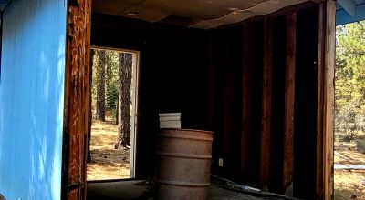 Huge trees. Wet weather stream in back * Fixer upper  or Tear it down and start over again